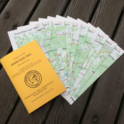 yellow guidebook with 10 color maps