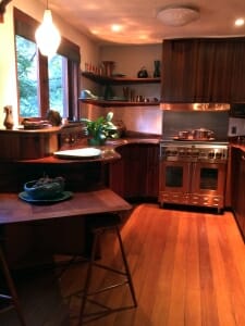 kitchen with curving wood counter and shelves