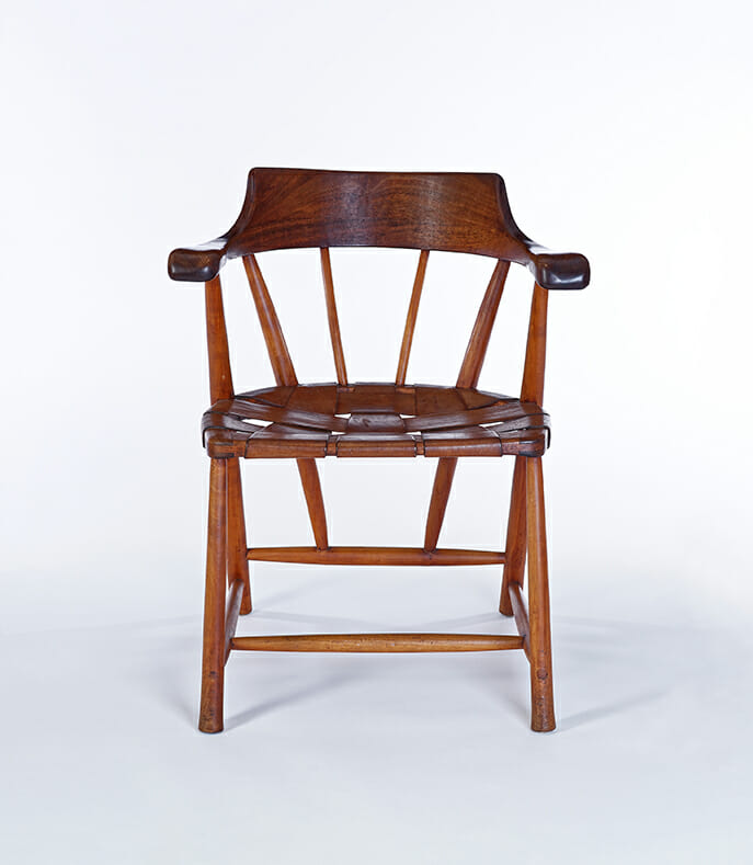 wood chair with armrests and laced leather seat