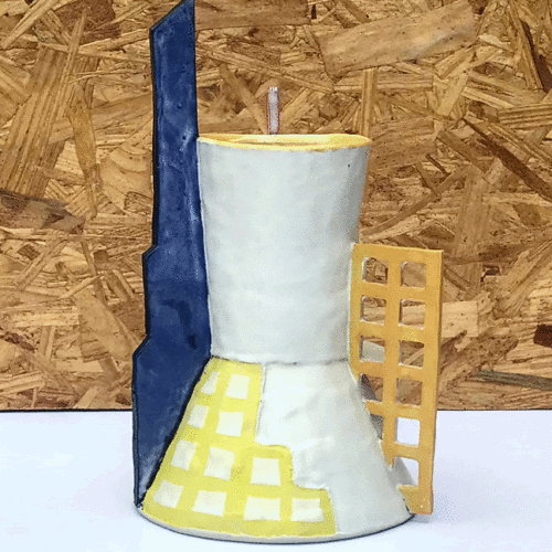 ceramic vessel or white porcelain with a tall blue form on left, and yellow grid on right and a painted yellow grid on the base