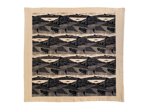 beige tea towel with repeating block print pattern